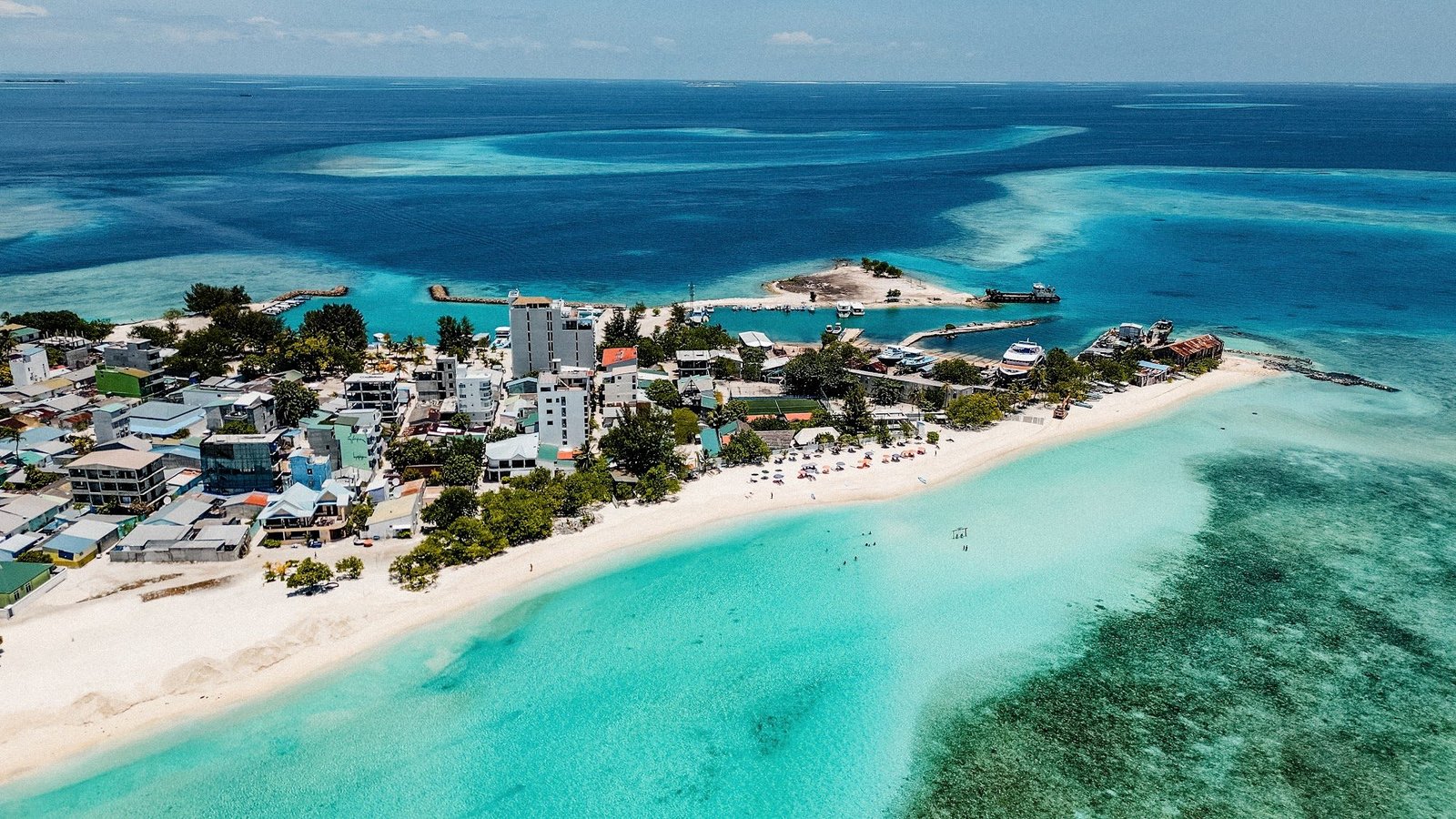 Aerial view of a local island and its white-sand beach